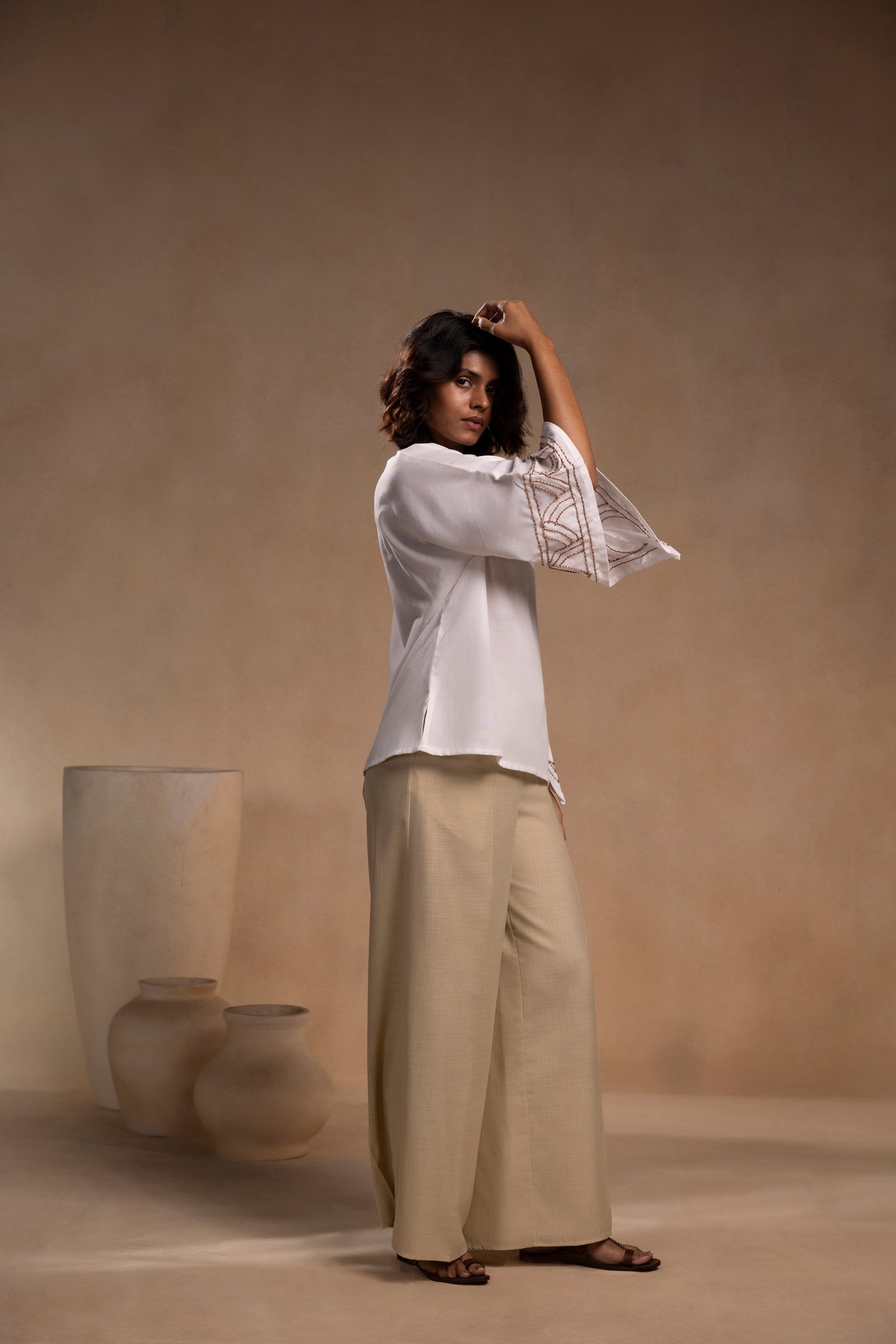 White cotton relaxed-fit top with round neck and sleeves for effortless comfort