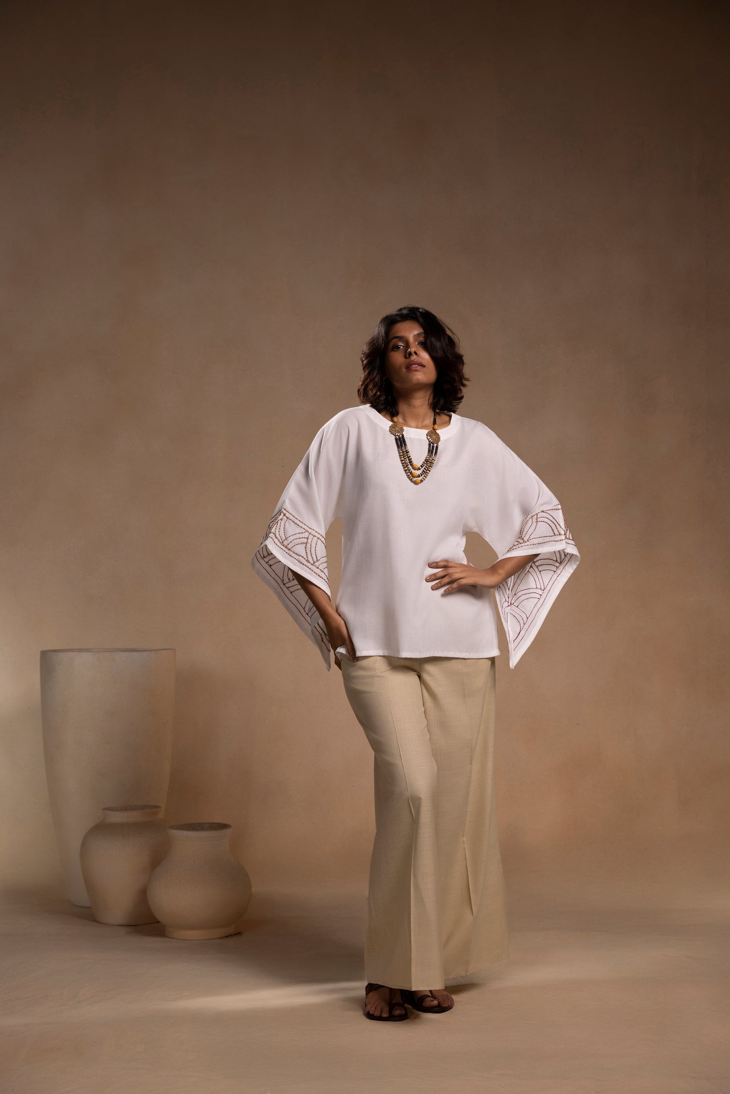 White cotton relaxed-fit top with round neck and sleeves for effortless comfort