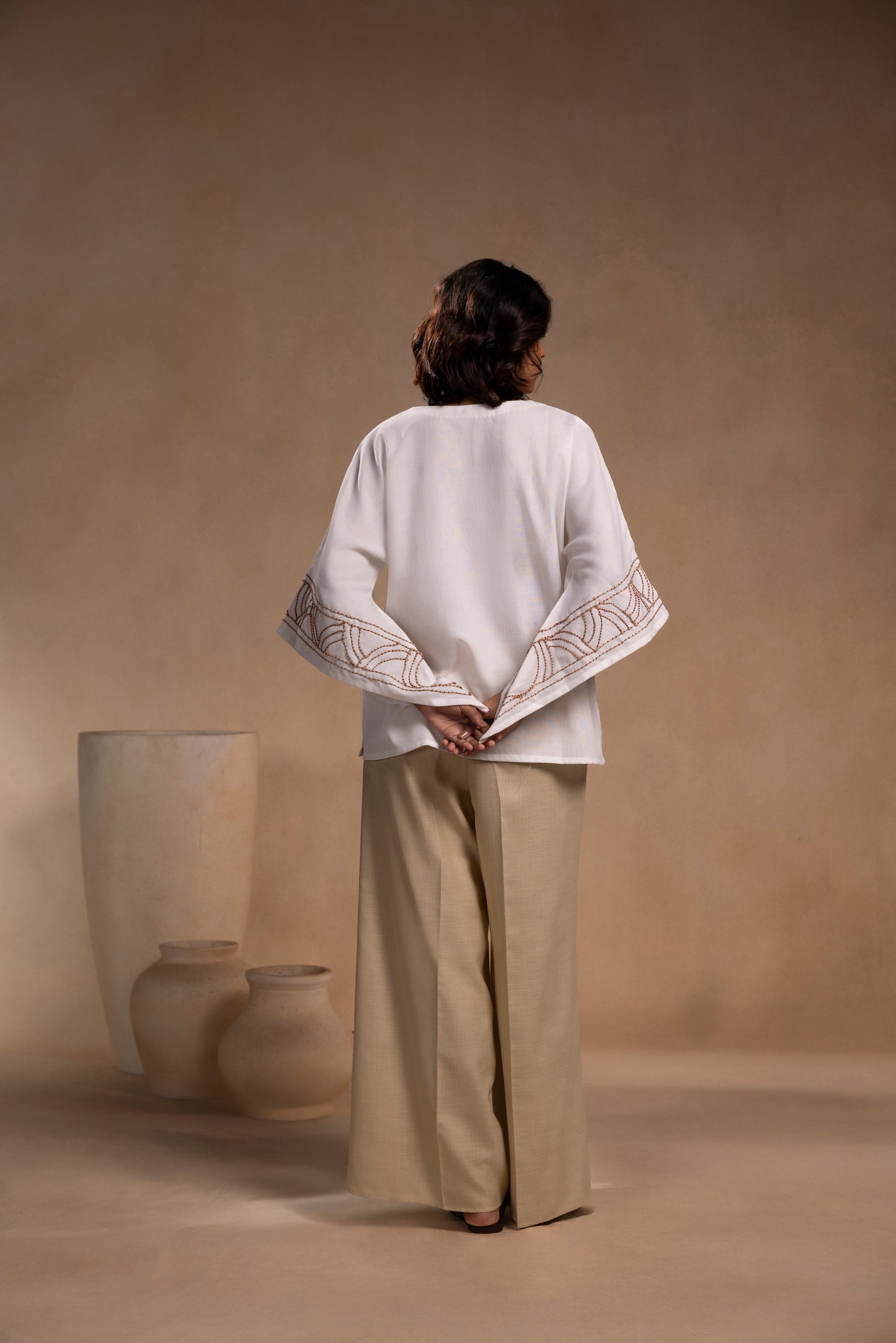White cotton relaxed-fit top with round neck and sleeves for effortless comfort